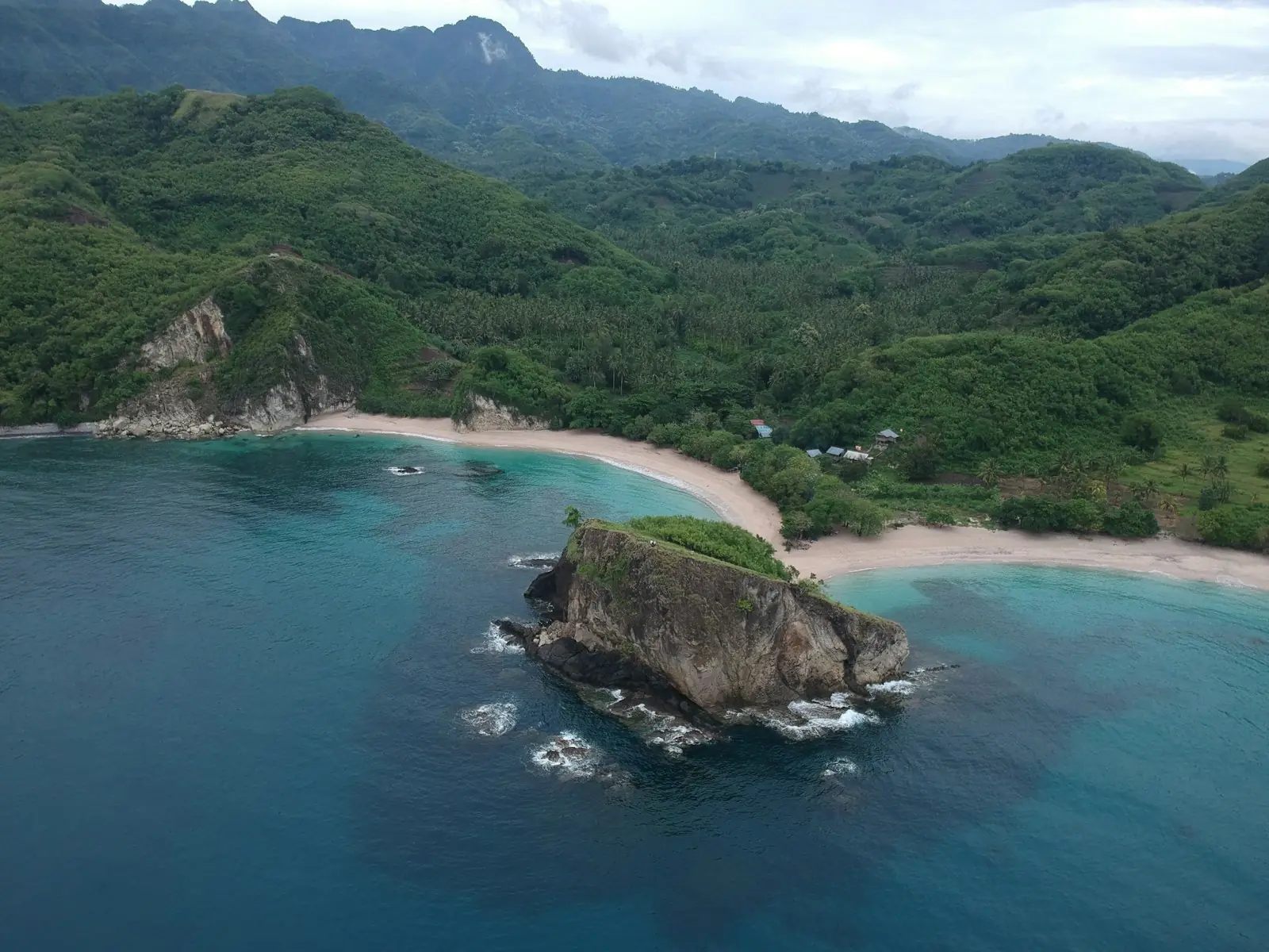 Aerial view of a rocky islet and sheltered bay off Lombok