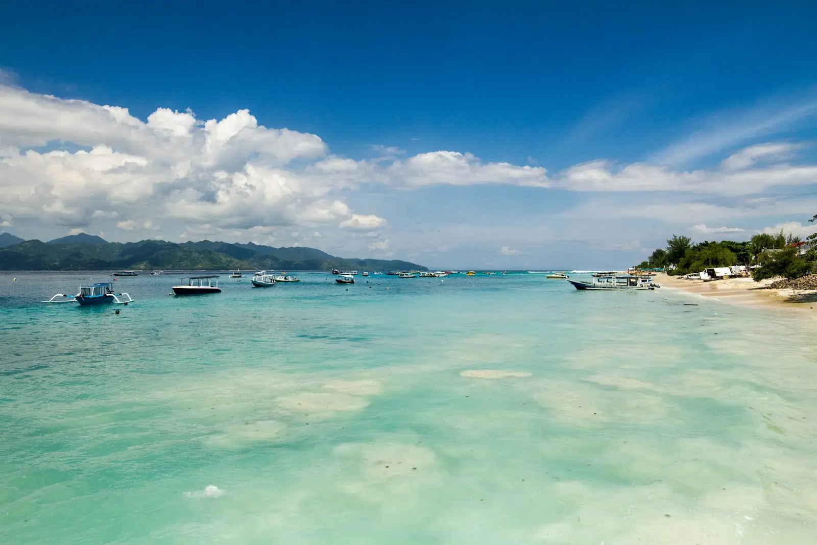 Lombok Diving team guiding divers over a Gili reef